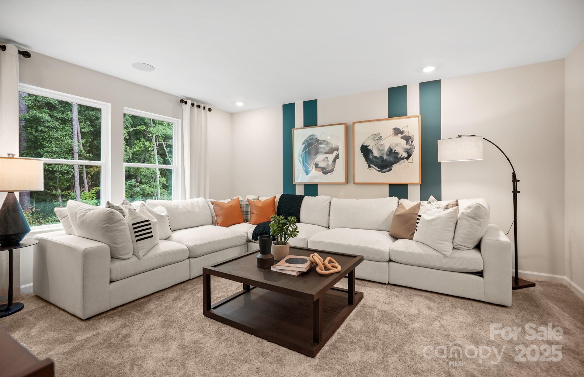 12016 Rails Court, Unit 516 Charlotte, NC 28278 - Photo 24 of 39 a living room with furniture and a large window