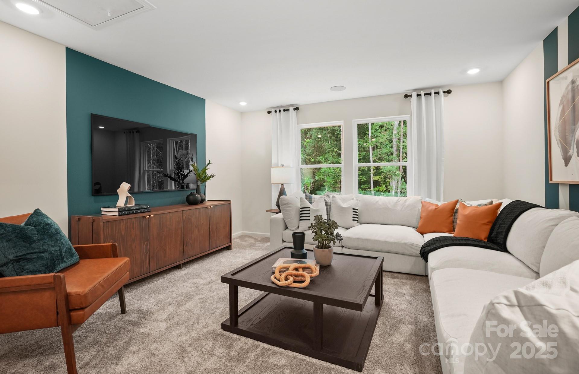12016 Rails Court, Unit 516 Charlotte, NC 28278 - Photo 25 of 39 a living room with furniture and a large window