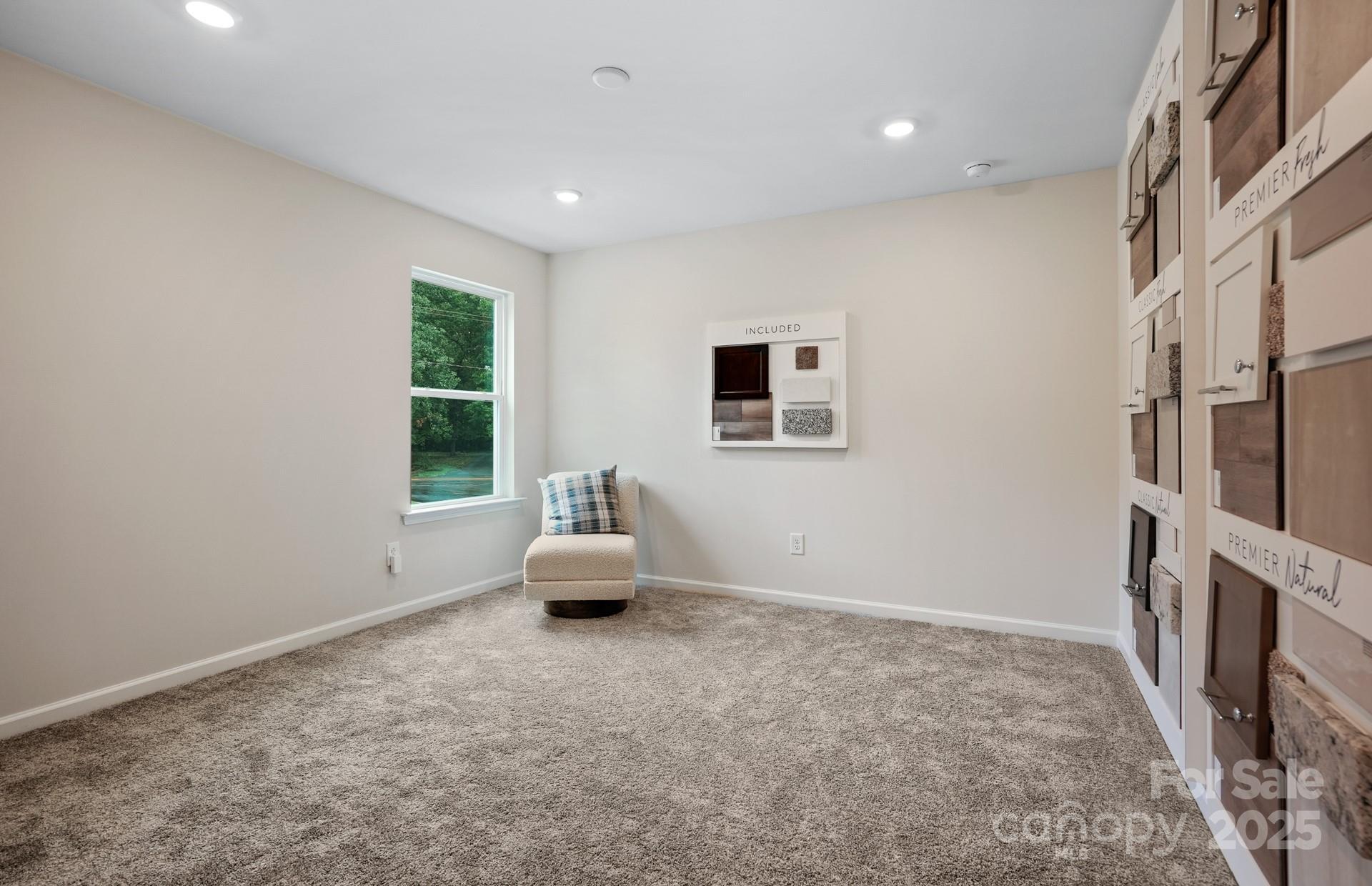 12016 Rails Court, Unit 516 Charlotte, NC 28278 - Photo 34 of 39 a living room with furniture and a flat screen tv