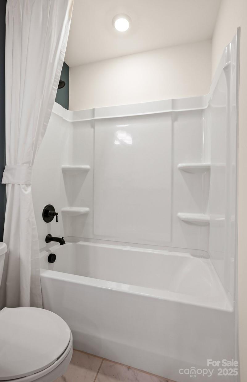 12016 Rails Court, Unit 516 Charlotte, NC 28278 - Photo 39 of 39 a bathroom with a bathtub and a toilet