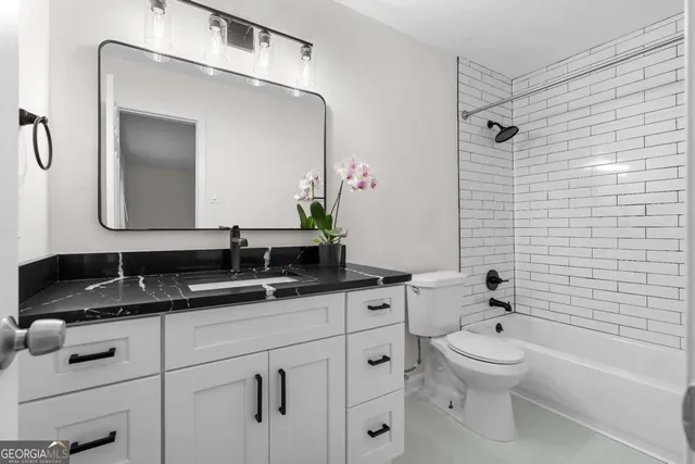 a bathroom with a white bathtub