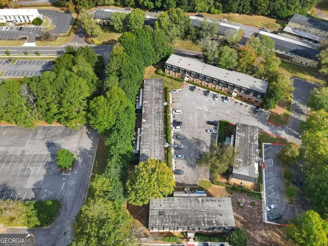 a view of a house with backyard patio and swimming pool