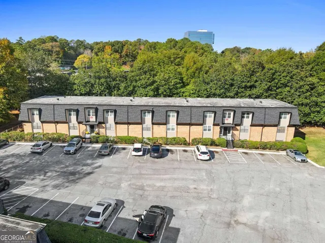 an aerial view of residential houses with outdoor space