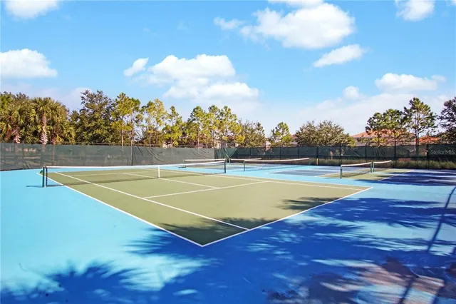a view of a swimming pool with an outdoor space and seating area