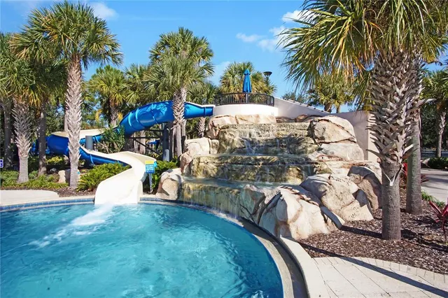 a view of a park with iron fence