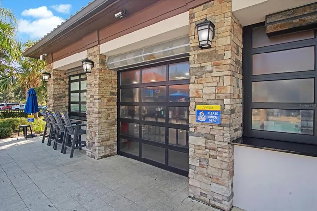 a living room with furniture piano and a fireplace