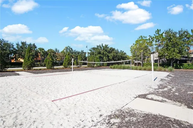 a view of a swimming pool with a patio and a yard