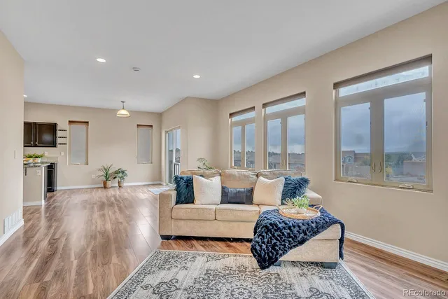 a living room with furniture and a large window