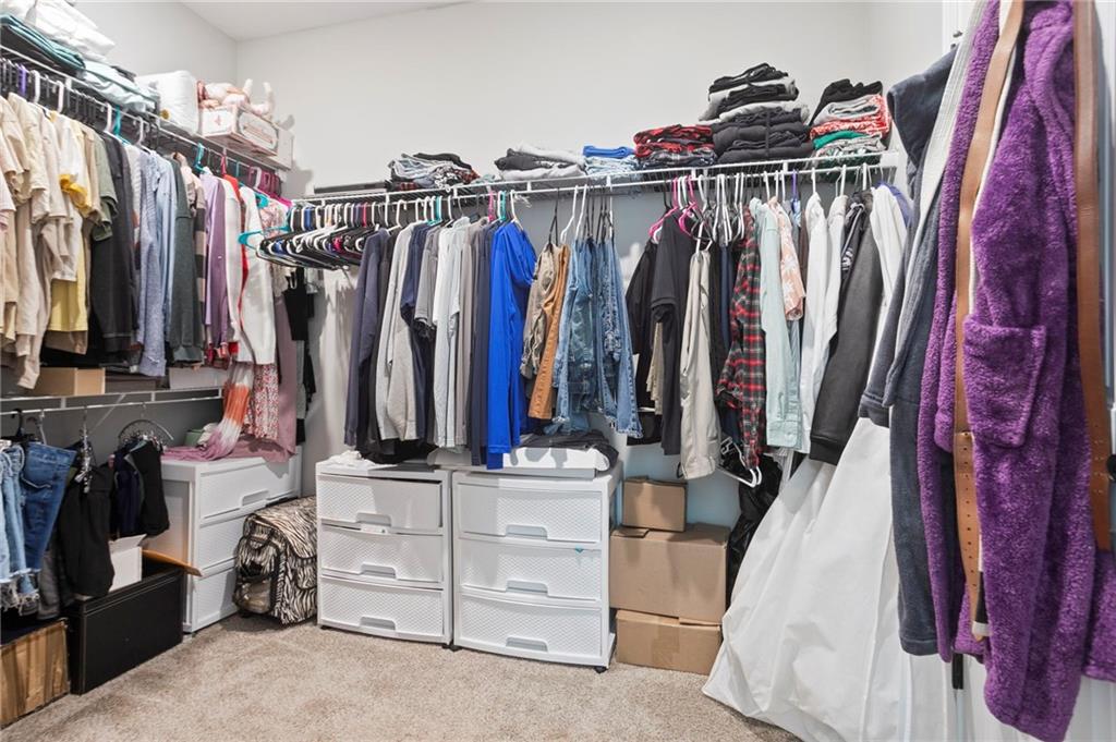 64 Neal Little Road Carnesville, GA 30521 - Photo 13 of 17 a view of walk in closet with clothes