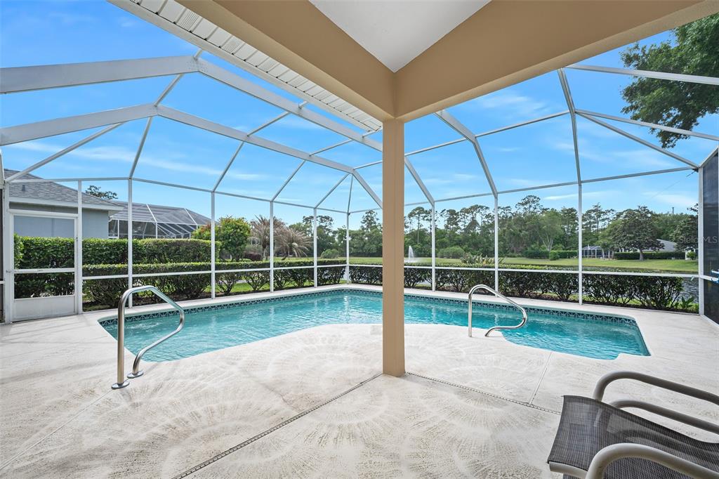 8 Gale Lane Ormond Beach, FL 32174 - Photo 23 of 77 a view of a chair and tables in the back yard
