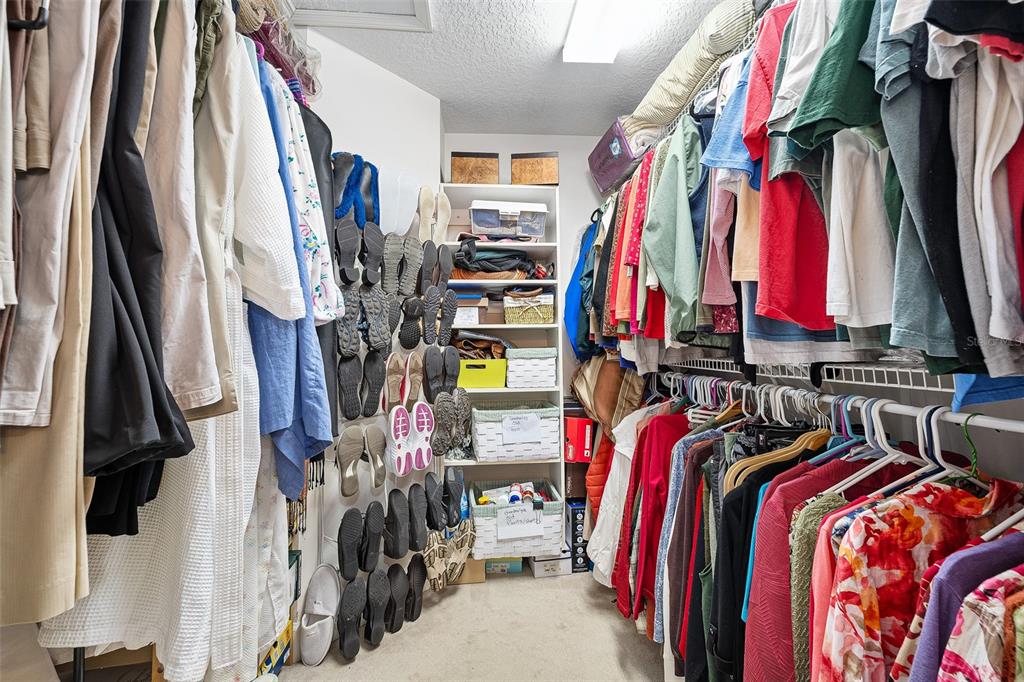 8 Gale Lane Ormond Beach, FL 32174 - Photo 29 of 77 a view of walk in closet with clothes
