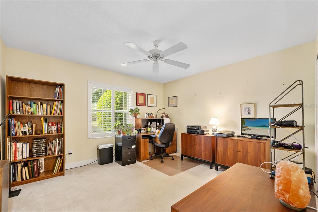 8 Gale Lane Ormond Beach, FL 32174 - Photo 32 of 77 a view of a workspace with furniture and a bookshelf