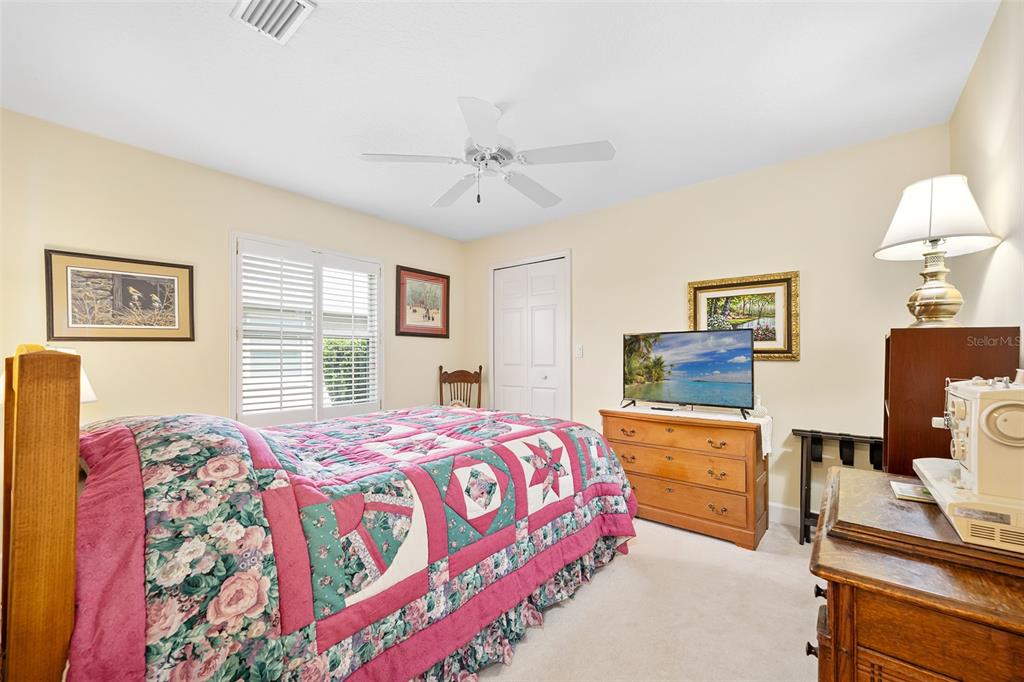 8 Gale Lane Ormond Beach, FL 32174 - Photo 35 of 77 a bedroom with a bed and a table in it