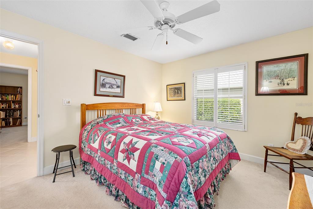 8 Gale Lane Ormond Beach, FL 32174 - Photo 36 of 77 a bedroom with a bed and a chandelier