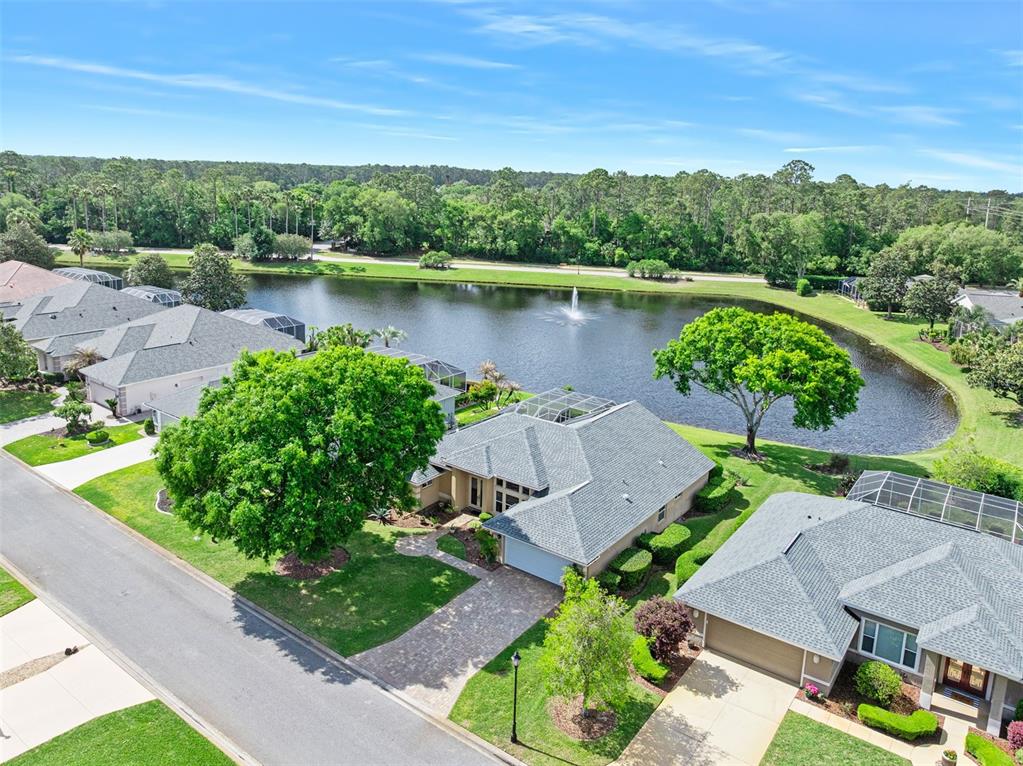 8 Gale Lane Ormond Beach, FL 32174 - Photo 38 of 77 an aerial view of a house with garden space and a lake view