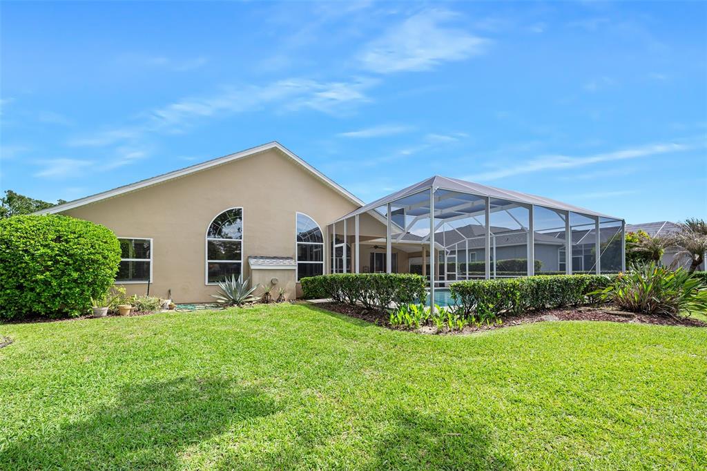 8 Gale Lane Ormond Beach, FL 32174 - Photo 50 of 77 a view of a house with backyard and garden