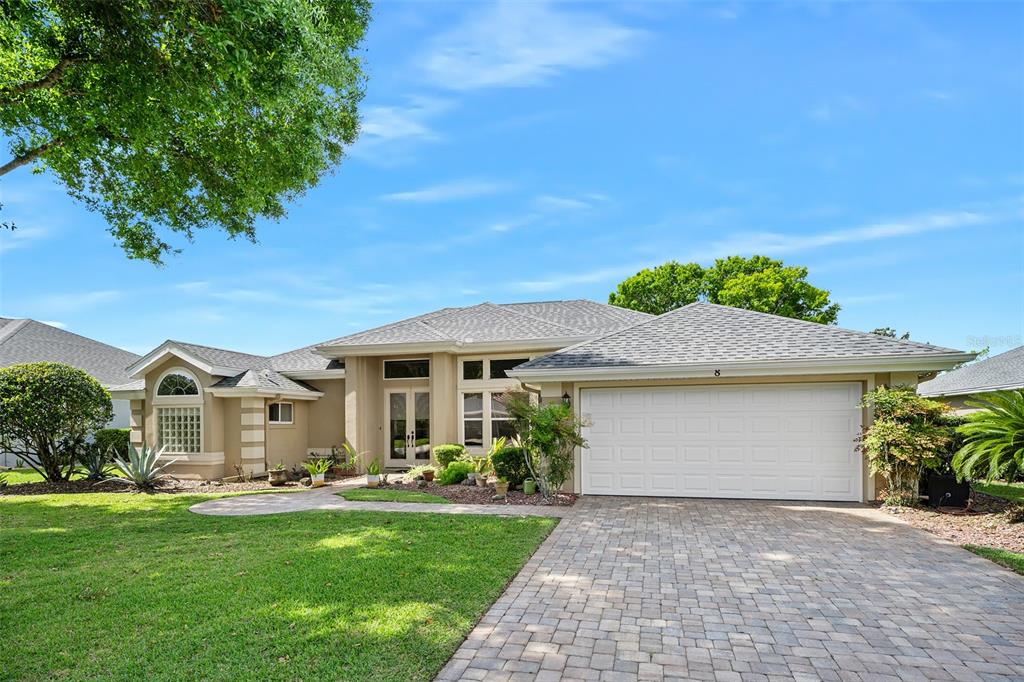 8 Gale Lane Ormond Beach, FL 32174 - Photo 5 of 77 a front view of a house with a garden and plants