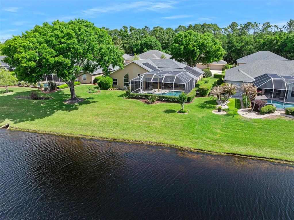 8 Gale Lane Ormond Beach, FL 32174 - Photo 51 of 77 a view of a house with garden and trees