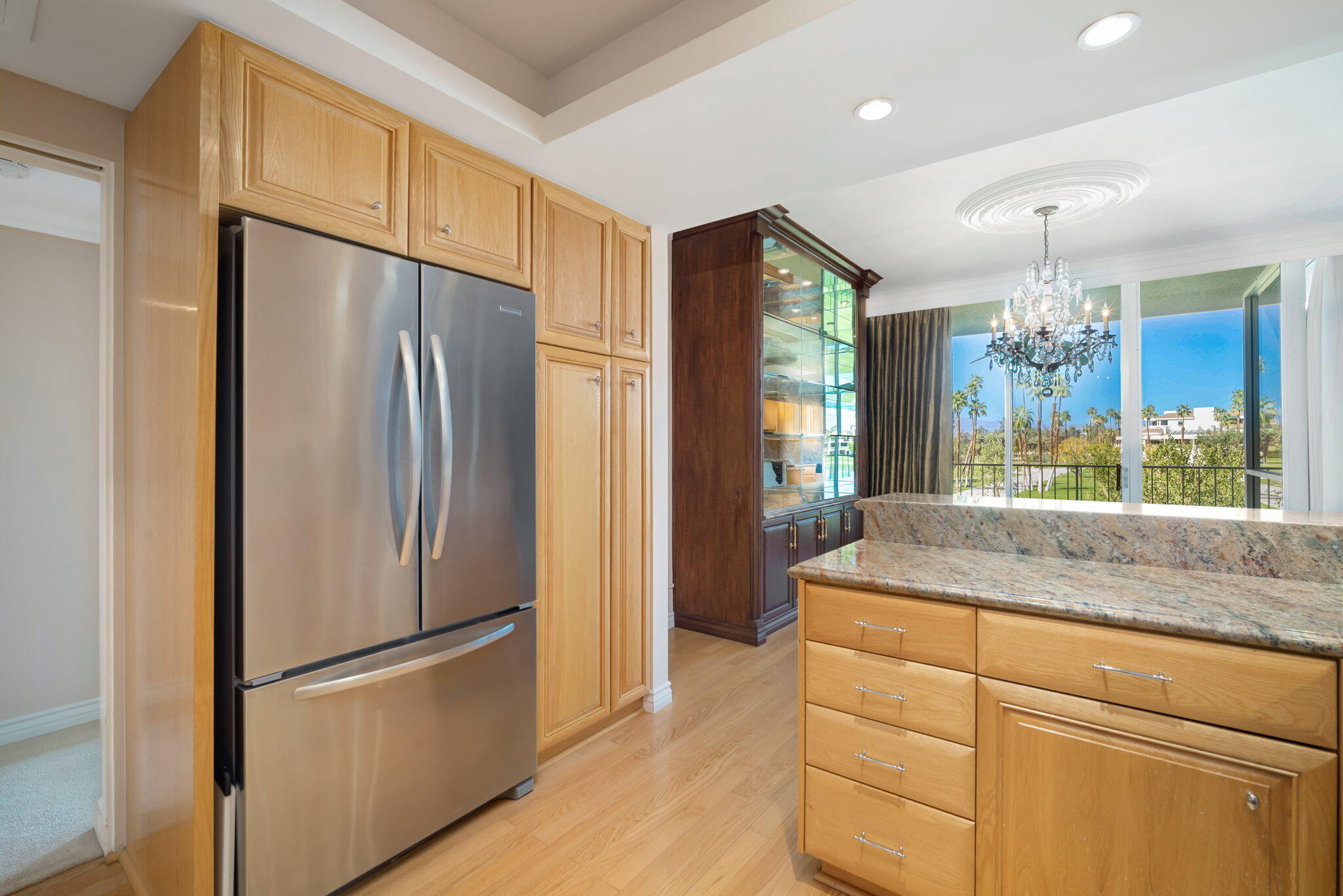 900 Island Drive, Unit 304 Rancho Mirage, CA 92270 - Photo 17 of 27 a kitchen with stainless steel appliances granite countertop a refrigerator and a sink