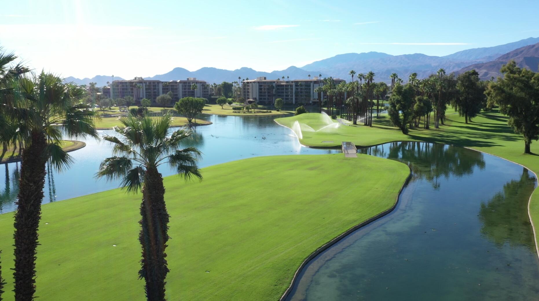 900 Island Drive, Unit 304 Rancho Mirage, CA 92270 - Photo 26 of 27 a view of a lake with a mountain in the background