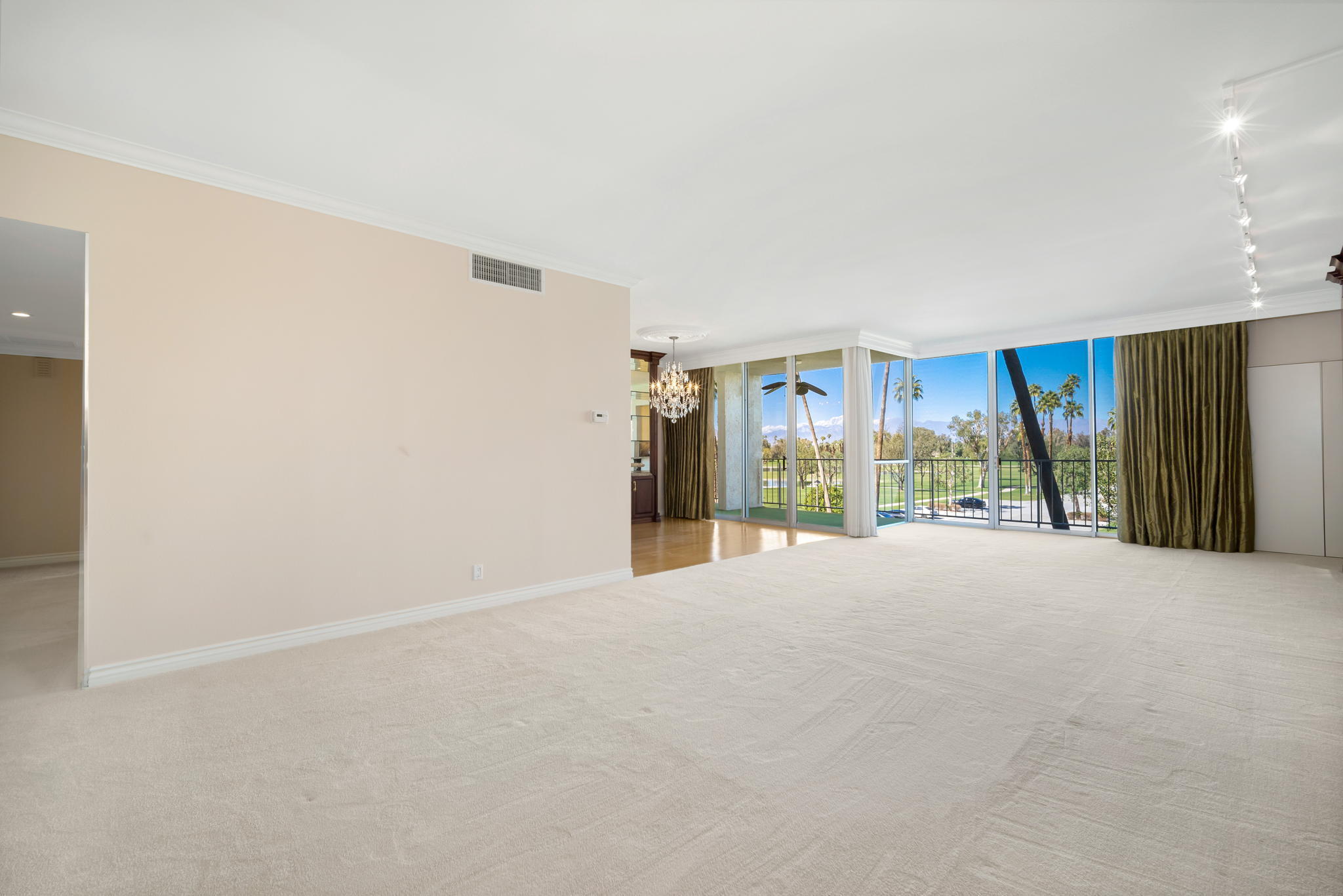 900 Island Drive, Unit 304 Rancho Mirage, CA 92270 - Photo 5 of 27 a view of an empty room with a balcony