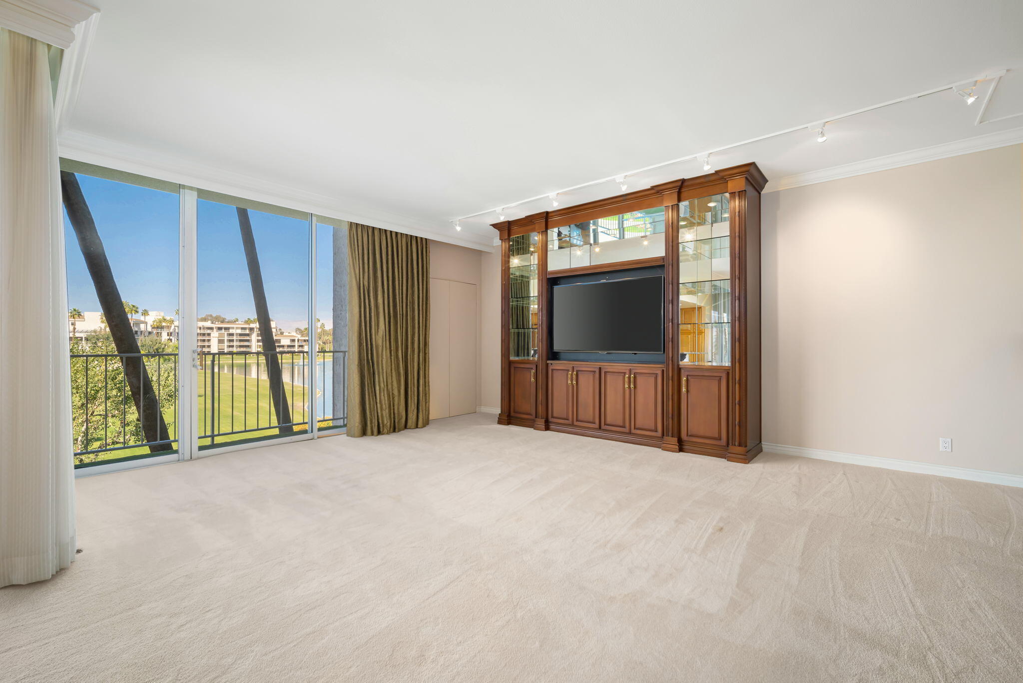 900 Island Drive, Unit 304 Rancho Mirage, CA 92270 - Photo 9 of 27 a view of an empty room with a window