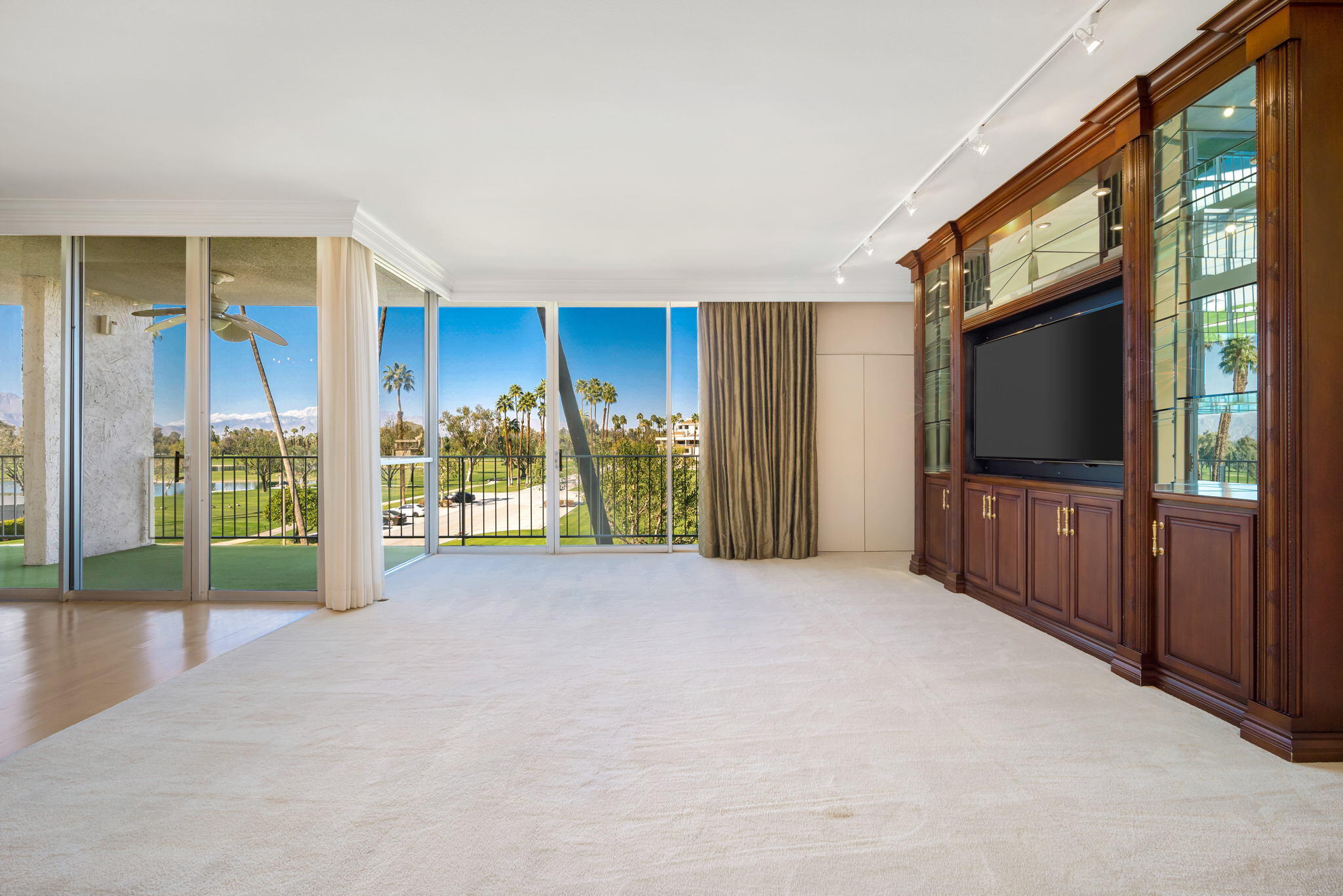 900 Island Drive, Unit 304 Rancho Mirage, CA 92270 - Photo 10 of 27 a view of a livingroom with an empty room and fire place