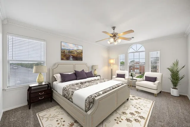 a bedroom with a large bed and a couch