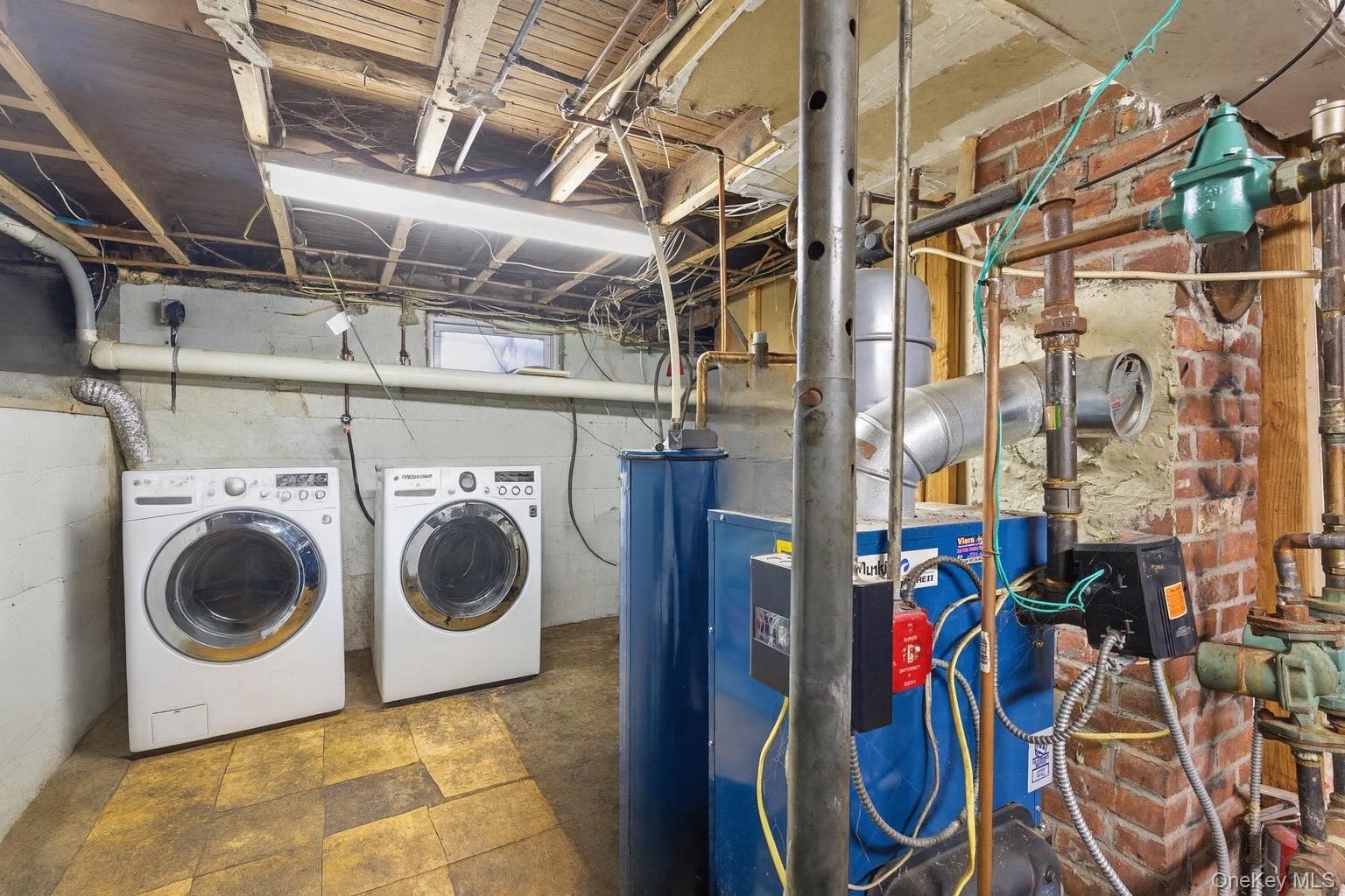 36 Ralph Avenue Brentwood, NY 11717 - Photo 19 of 23 a utility room with dryer and washer