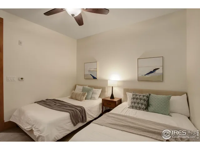 a bathroom with a granite countertop sink toilet a mirror and shower