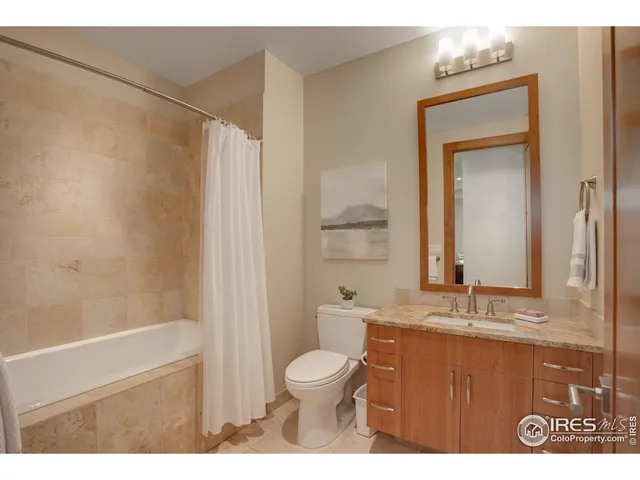 a balcony with table and chairs