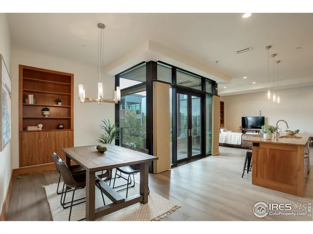 a living room with stainless steel appliances kitchen island granite countertop furniture and a view of kitchen