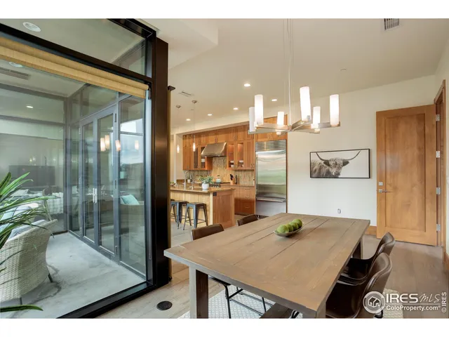 a kitchen with kitchen island granite countertop a table and chairs