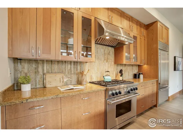a kitchen view with cabinets and a stove