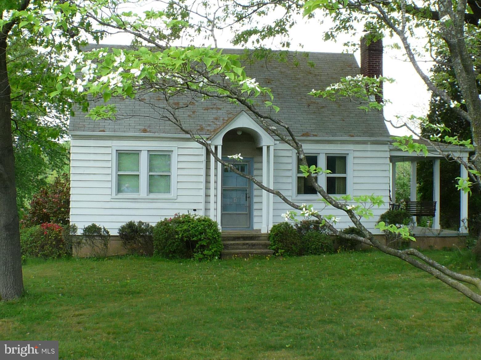2600 Briggs Chaney Road Silver Spring, MD 20905 - Photo 1 of 20 a front view of a house with a garden and yard