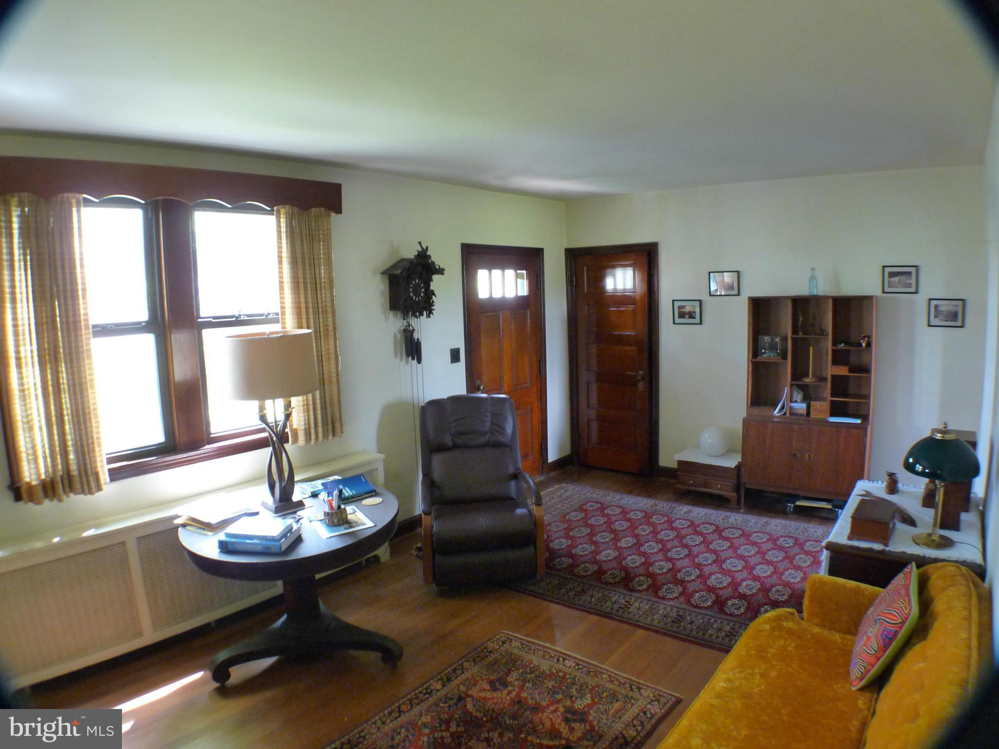 2600 Briggs Chaney Road Silver Spring, MD 20905 - Photo 2 of 20 a living room with furniture and wooden floor