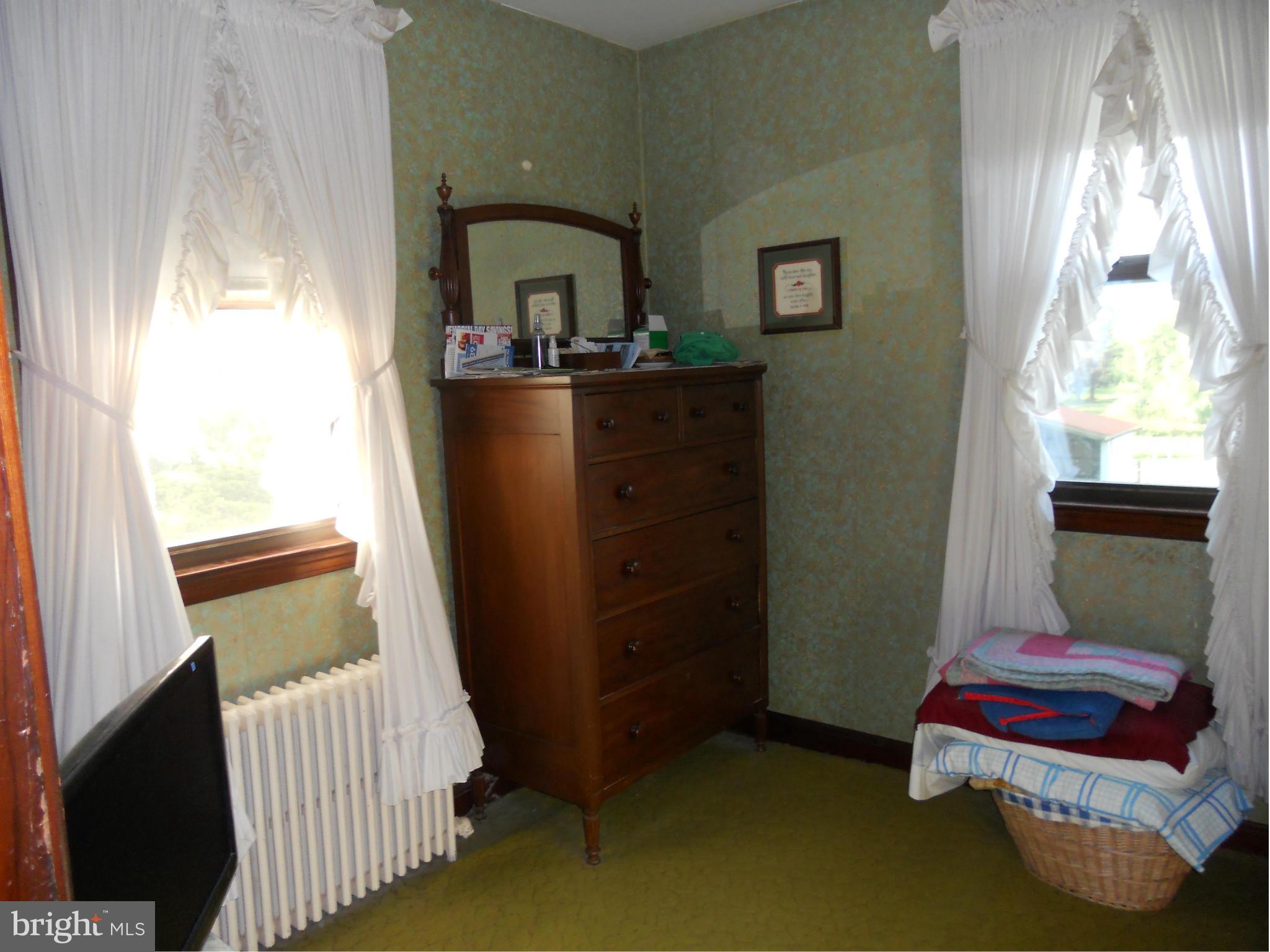 2600 Briggs Chaney Road Silver Spring, MD 20905 - Photo 11 of 20 a bedroom with a bed and window
