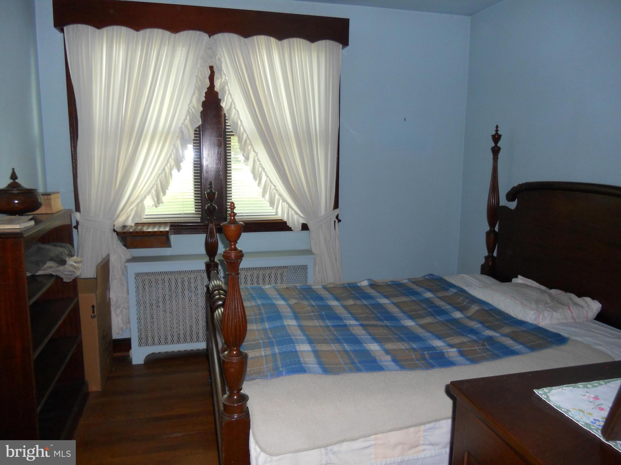 2600 Briggs Chaney Road Silver Spring, MD 20905 - Photo 10 of 20 a bedroom with a bed and a window