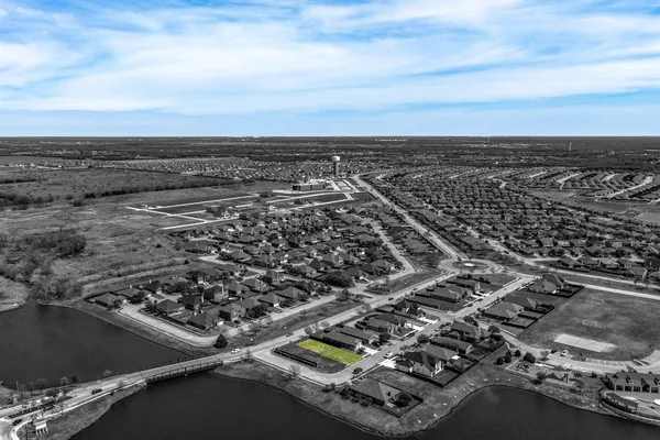 an aerial view of a house with a swimming pool