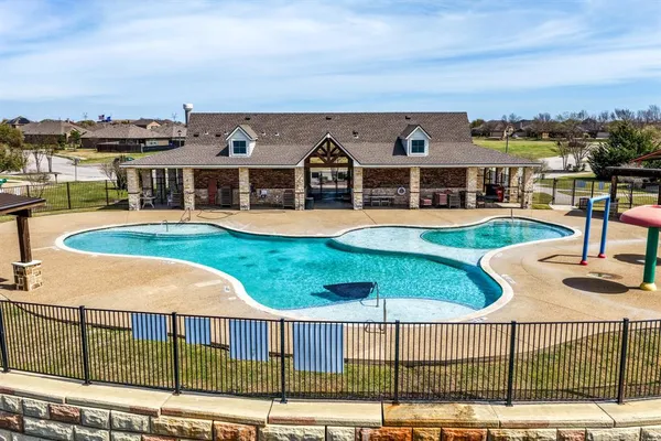 an aerial view of a house with swimming pool