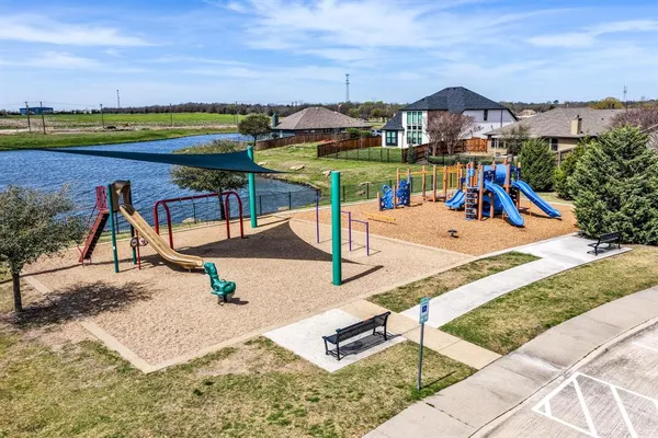 a view of a swimming pool with a yard and mountain view