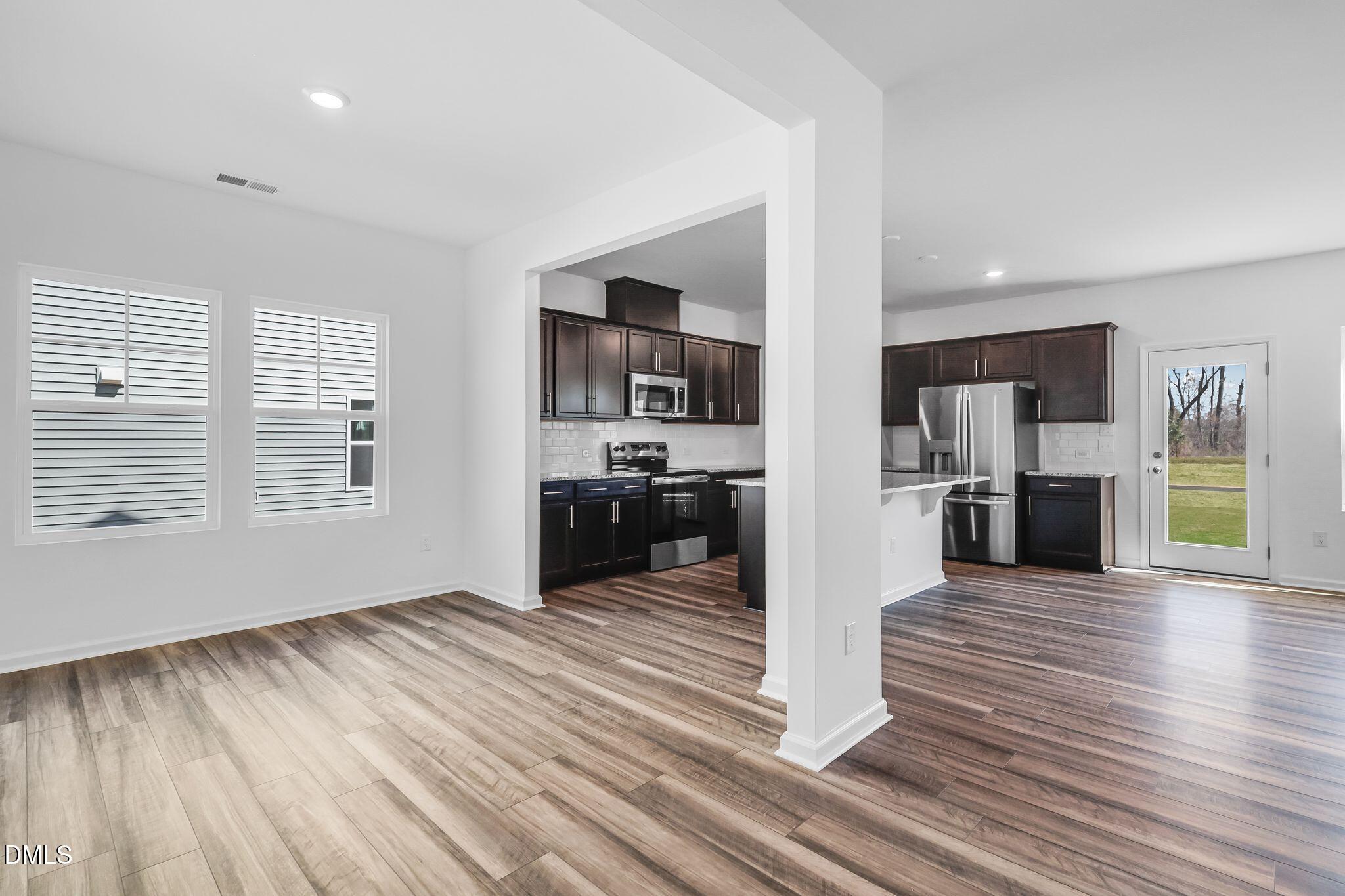 5818 Millstone Way Sims, NC 27880 - Photo 6 of 24 a view of a kitchen with wooden floor and a kitchen