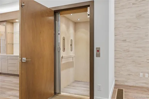 view of a bathroom with a glass door and shower
