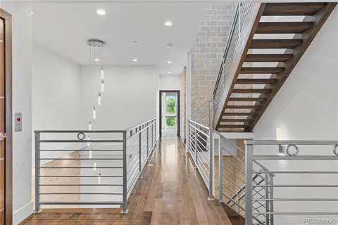 a view of entryway with wooden floor