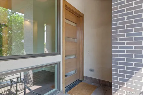 a view of a glass door with a bathroom