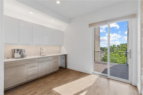 a view of a kitchen with sink and window