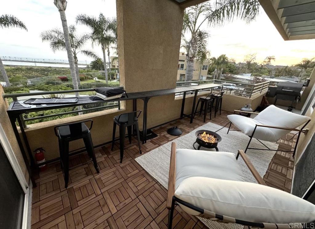 805 Kalpati Circle, Unit 232 Carlsbad, CA 92008 - Photo 1 of 1 a view of a patio with couches table and chairs