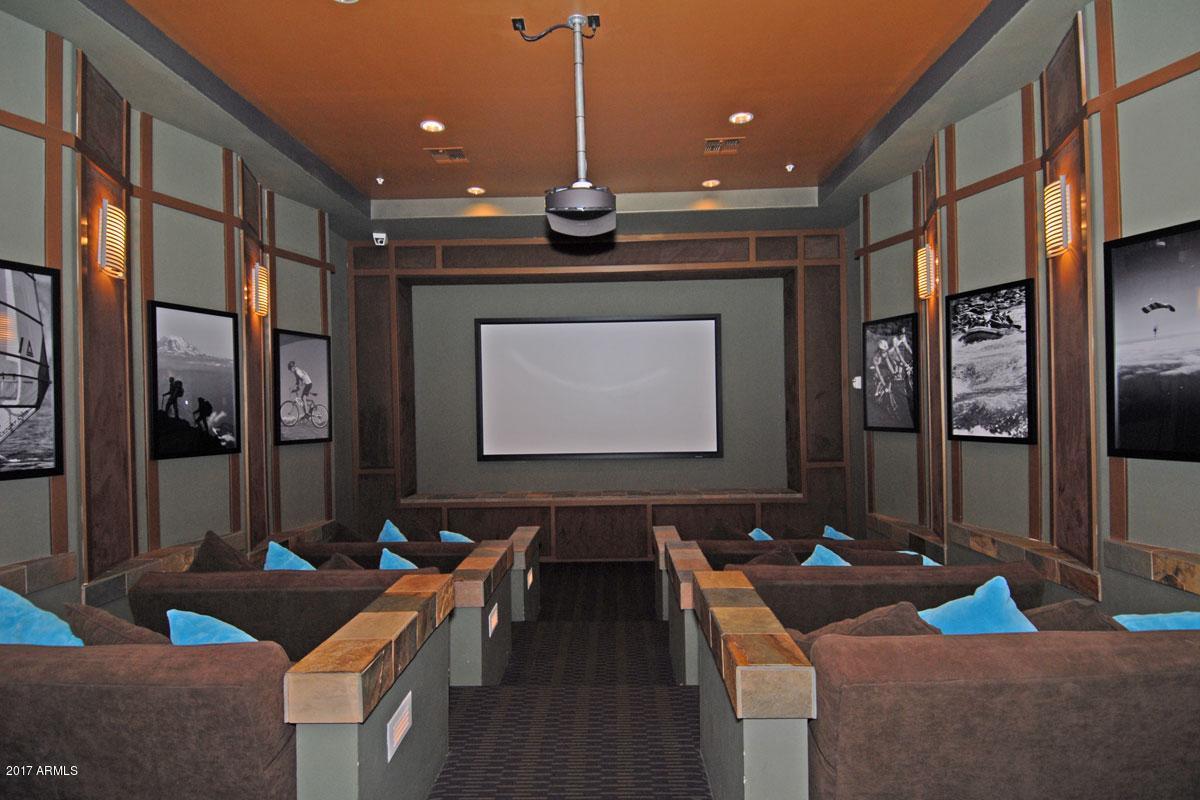20100 North 78th Place, Unit 2180 Scottsdale, AZ 85255 - Photo 15 of 16 a room with furniture a projector and screen
