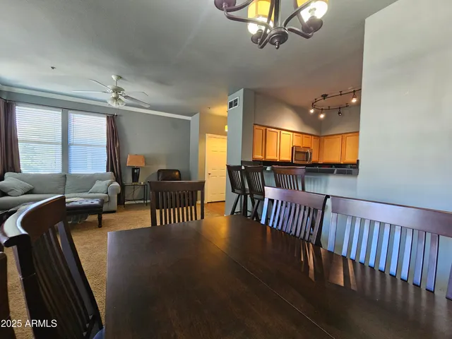 a view of a livingroom with furniture window and wooden floor