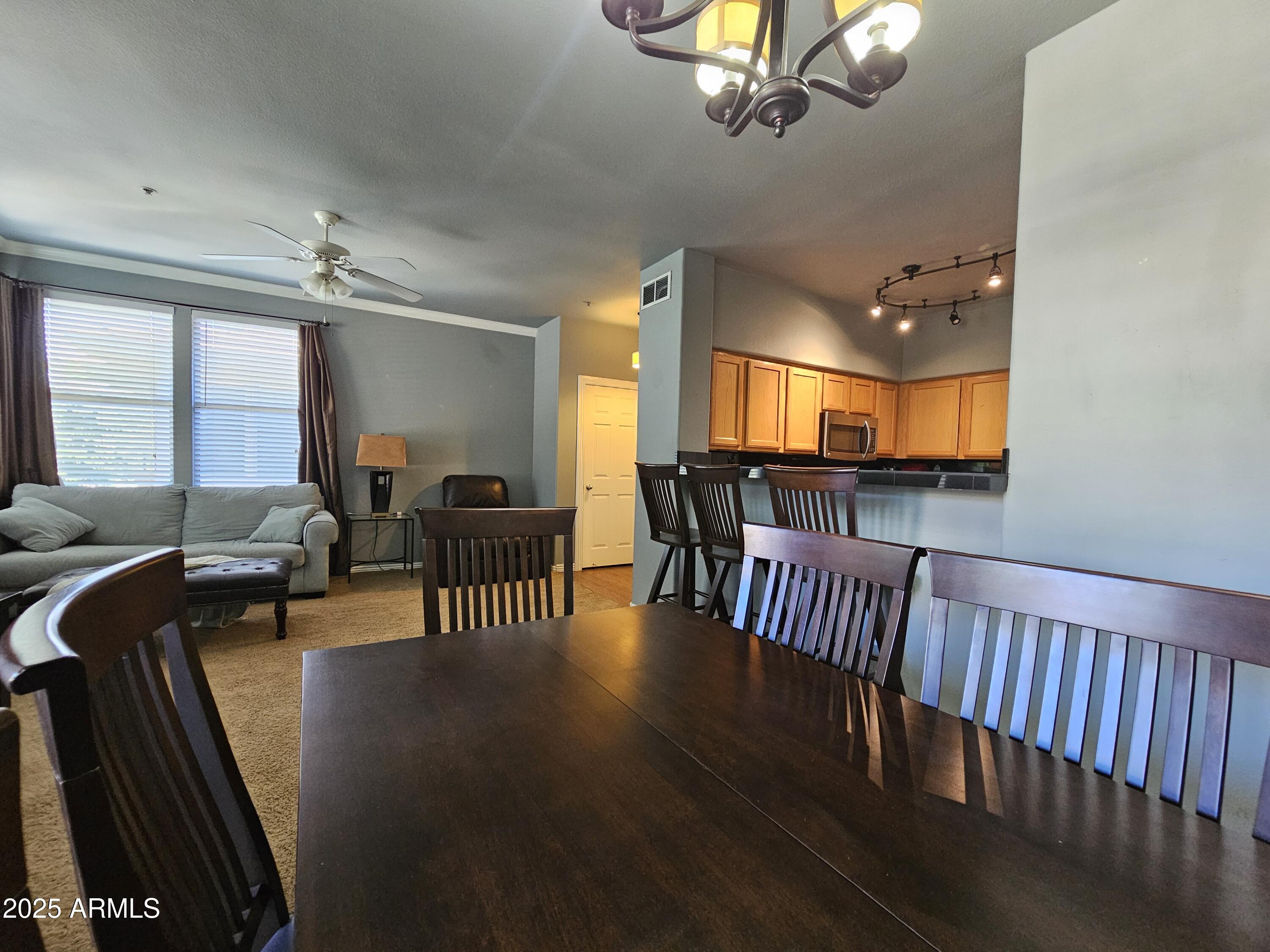 20100 North 78th Place, Unit 2180 Scottsdale, AZ 85255 - Photo 7 of 16 a view of a livingroom with furniture window and wooden floor
